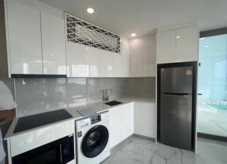 Modern kitchen with white cabinetry and appliances