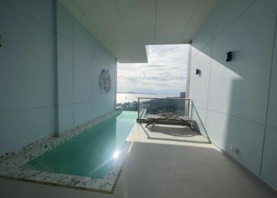 Outdoor area with small pool and ocean view