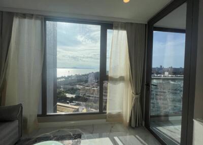 Living room with a view of the city and sea