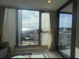 Living room with a view of the city and sea