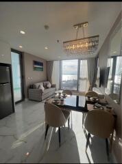 Modern living room with dining area and large windows