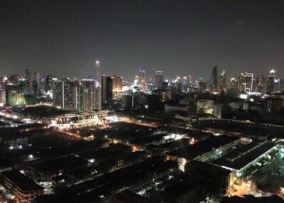 Night view of city skyline with illuminated buildings and streets