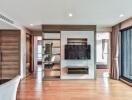 Modern living room with wooden flooring and large windows