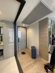 Modern hallway with wooden flooring and storage cabinets