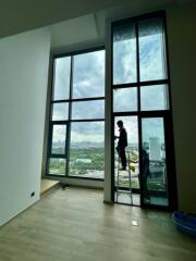 Living room with large windows and city view