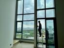 Living room with large windows and city view