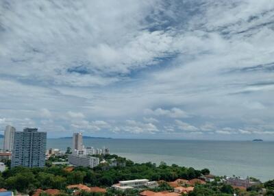 Scenic view of the city and ocean from a high-rise balcony