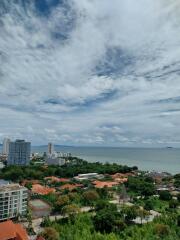 Scenic view of the city and ocean from a high-rise balcony