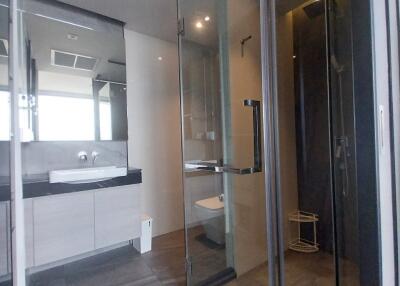 Modern bathroom with glass shower and sleek fixtures