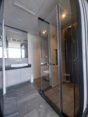 Modern bathroom with glass shower and sleek fixtures