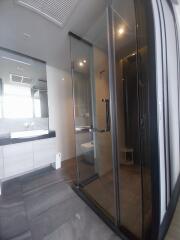 Modern bathroom with glass-enclosed shower and vanity