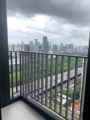 View of the city skyline from a balcony on a cloudy day