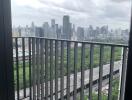 View of the city skyline from a balcony on a cloudy day