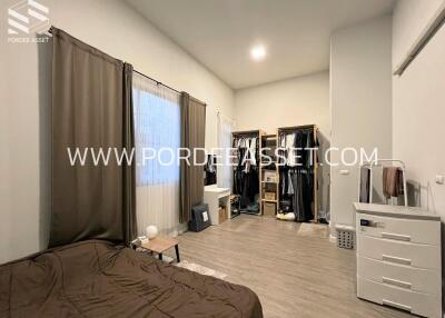 Spacious bedroom with wardrobe and dresser