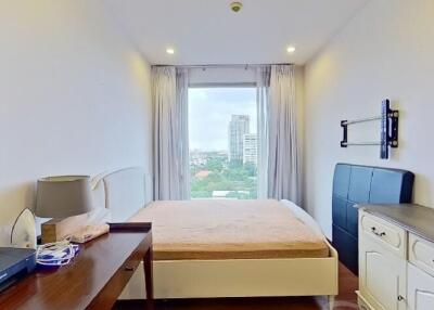 Bedroom with panoramic window view and minimalistic furniture