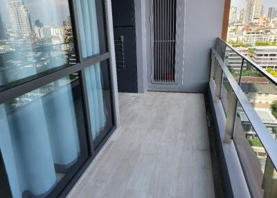 Balcony view of a residential area with cityscape in the background