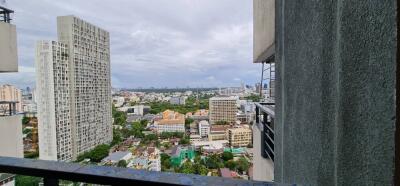 View from balcony featuring cityscape and high-rise buildings