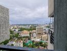 View from balcony featuring cityscape and high-rise buildings