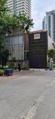 Exterior view of the Sathorn Gardens Condominium and the Embassy of Malaysia sign