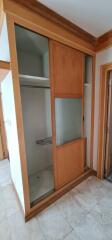 Closet with sliding doors in bedroom