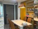 Modern dining area with marble table and brown chairs