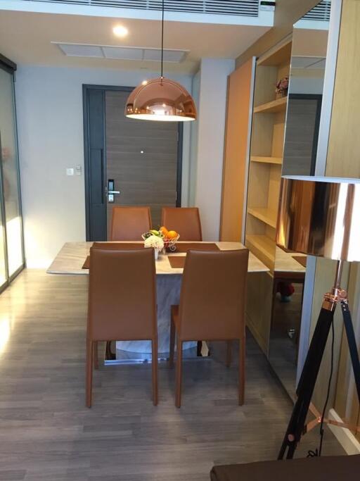 Modern dining room with a table set for four and contemporary lighting