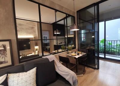 Modern living and dining area with glass partitions