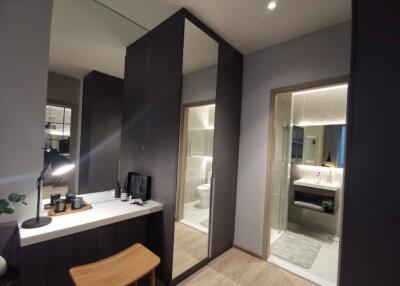 Modern bathroom with vanity, mirror, and glass-enclosed shower