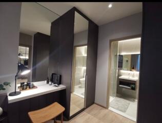 Modern bathroom with vanity, mirror, and glass-enclosed shower