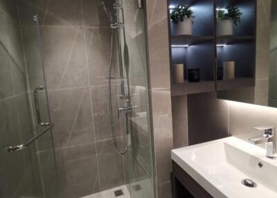 Modern bathroom with glass shower and sink