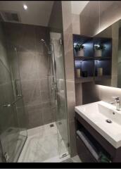 Modern bathroom with glass shower and sink