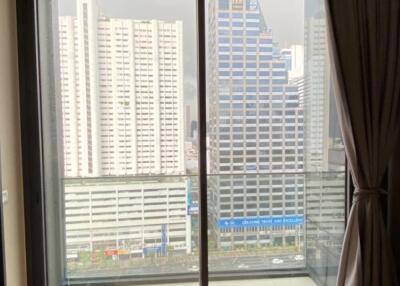 Living room with balcony and city view