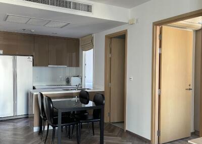 Modern kitchen and dining area with wooden flooring