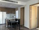 Modern kitchen and dining area with wooden flooring