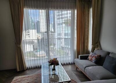 Modern living room with large window and city view