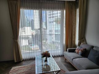 Modern living room with large window and city view