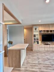 Modern living room with built-in shelving and entertainment center