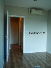 Bedroom 2 with open door and air conditioning unit