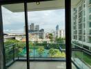 View from balcony with cityscape and high-rise buildings