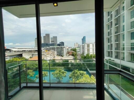 View from balcony with cityscape and high-rise buildings