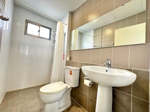 Modern bathroom with large mirror