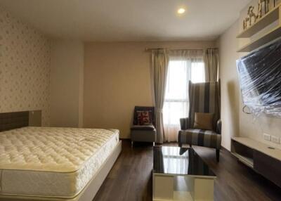 Spacious bedroom with double bed and seating area