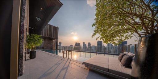 Luxurious outdoor terrace with pool and city skyline view