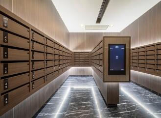 Mailroom with multiple mailboxes and digital display