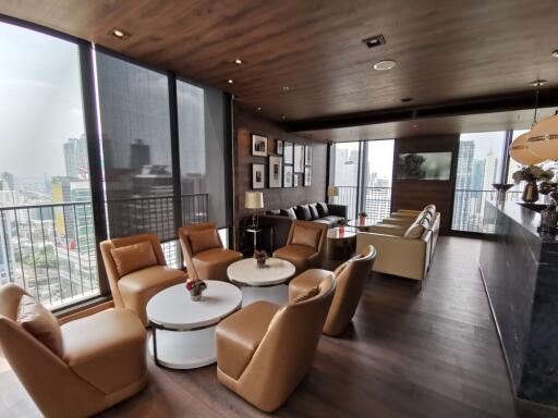 Spacious living room with city views and modern furniture