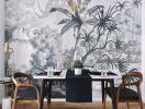 Stylish dining room with artistic wallpaper and modern furniture