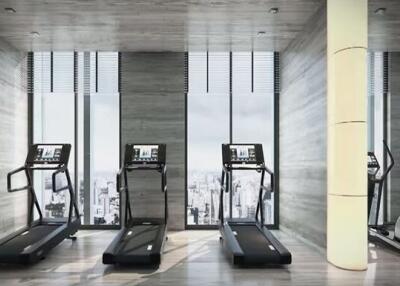 Fitness center with treadmills and large windows