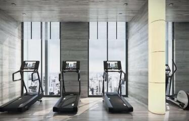 Fitness center with treadmills and large windows