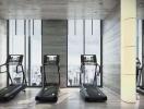 Fitness center with treadmills and large windows