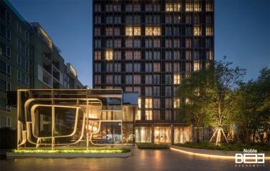 Evening view of Noble BE33 Sukhumvit building with modern architectural design exterior